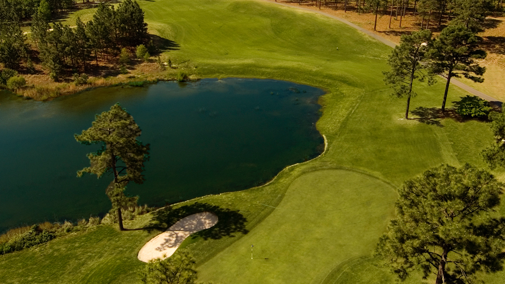 Panoramic view of a lush green golf course at Legacy. Smooth