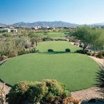 Panoramic view of a lush green golf course at Legend Trail Golf Club. Smooth