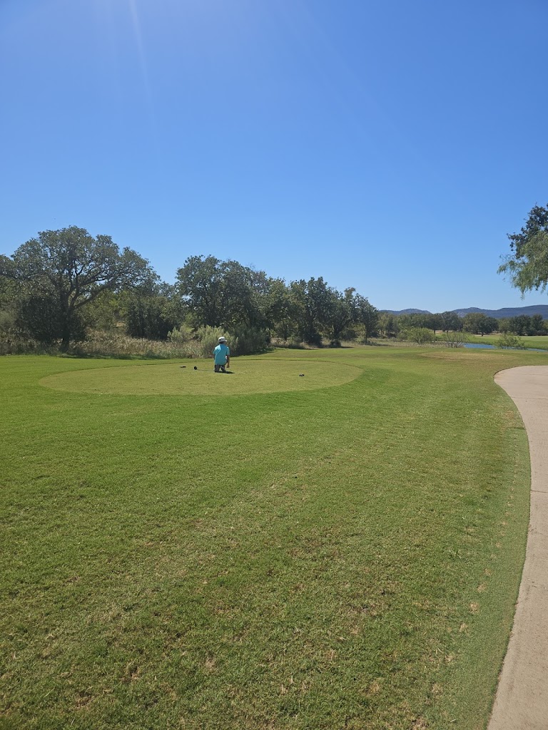 Panoramic view of a lush green golf course at Lighthouse Country Club. Smooth