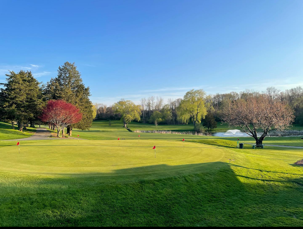 Panoramic view of a lush green golf course at Lincoln Country Club. Smooth