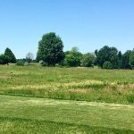 Panoramic view of a lush green golf course at Lincoln Valley Golf. Smooth