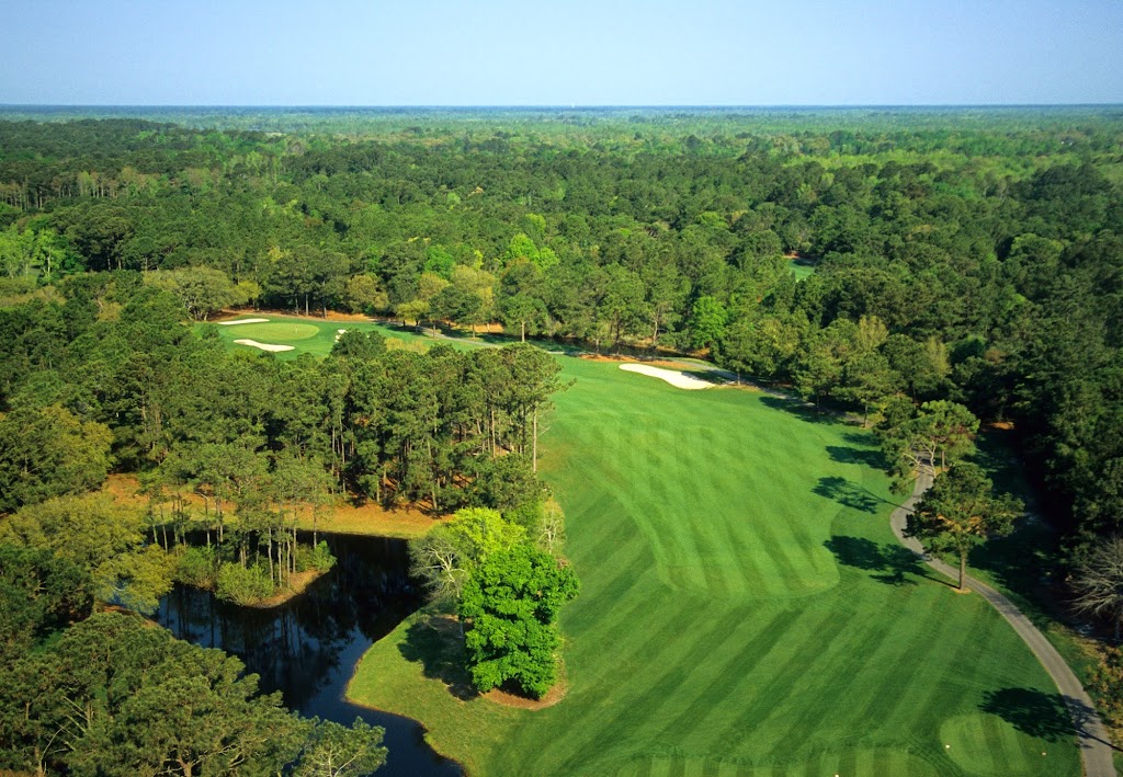 Panoramic view of a lush green golf course at Litchfield Country Club. Smooth