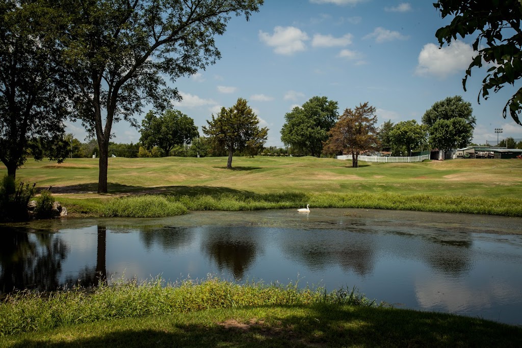 Panoramic view of a lush green golf course at Lit'l Links Golf Club. Smooth