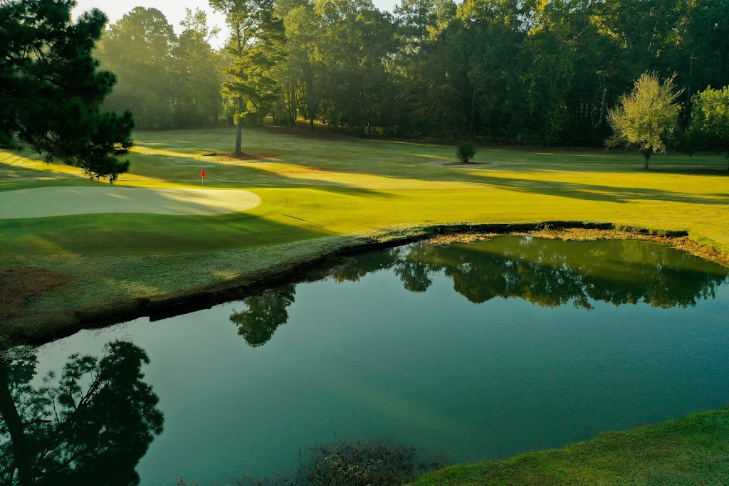 Panoramic view of a lush green golf course at Live Oaks Golf Club. Smooth