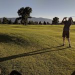 green grass with the flag in the hole.