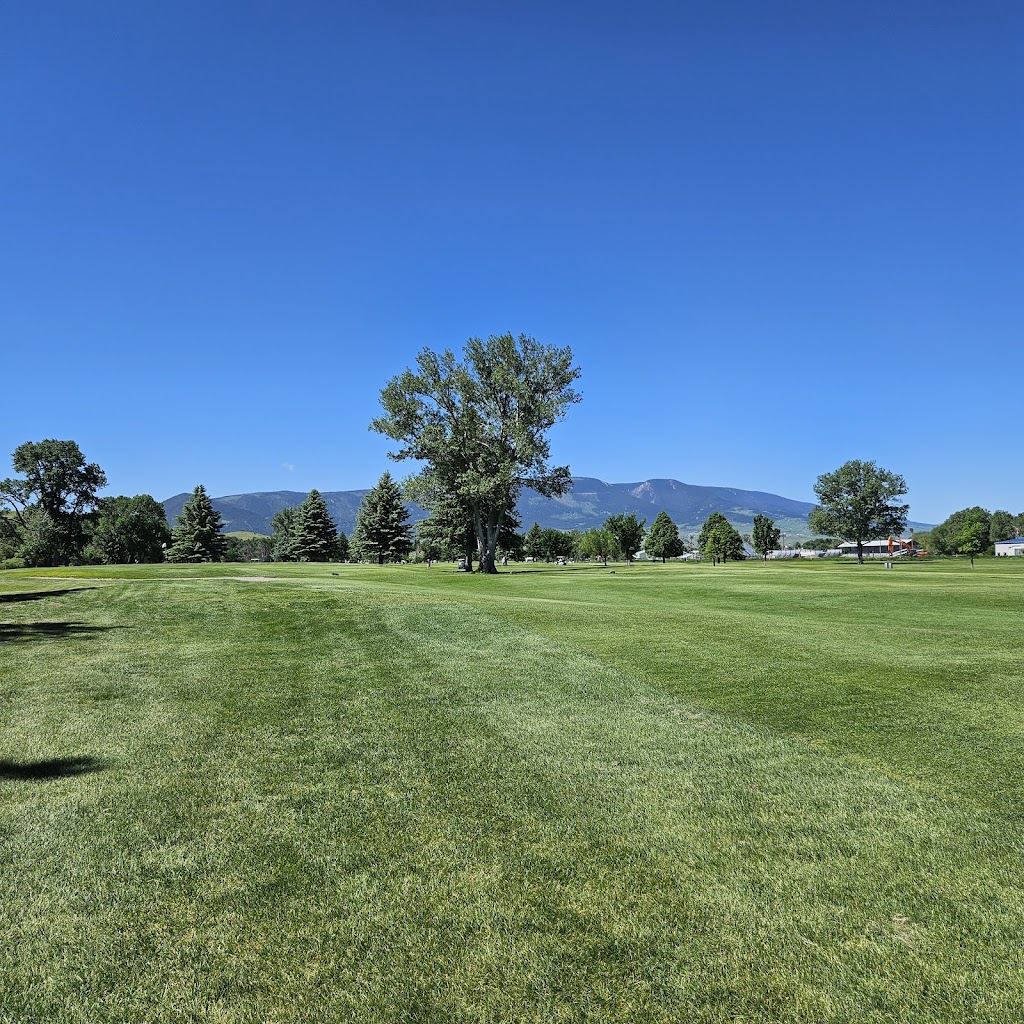 Panoramic view of a lush green golf course at Livingston Golf & Country Club. Smooth