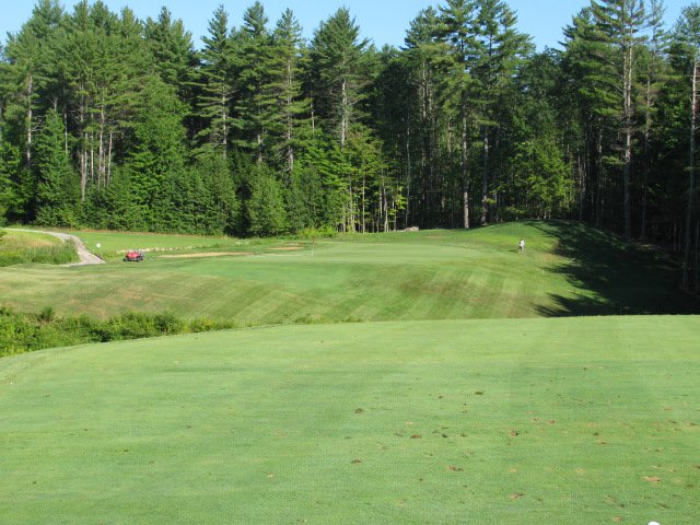 Panoramic view of a lush green golf course at Lochmere Country Club. Smooth