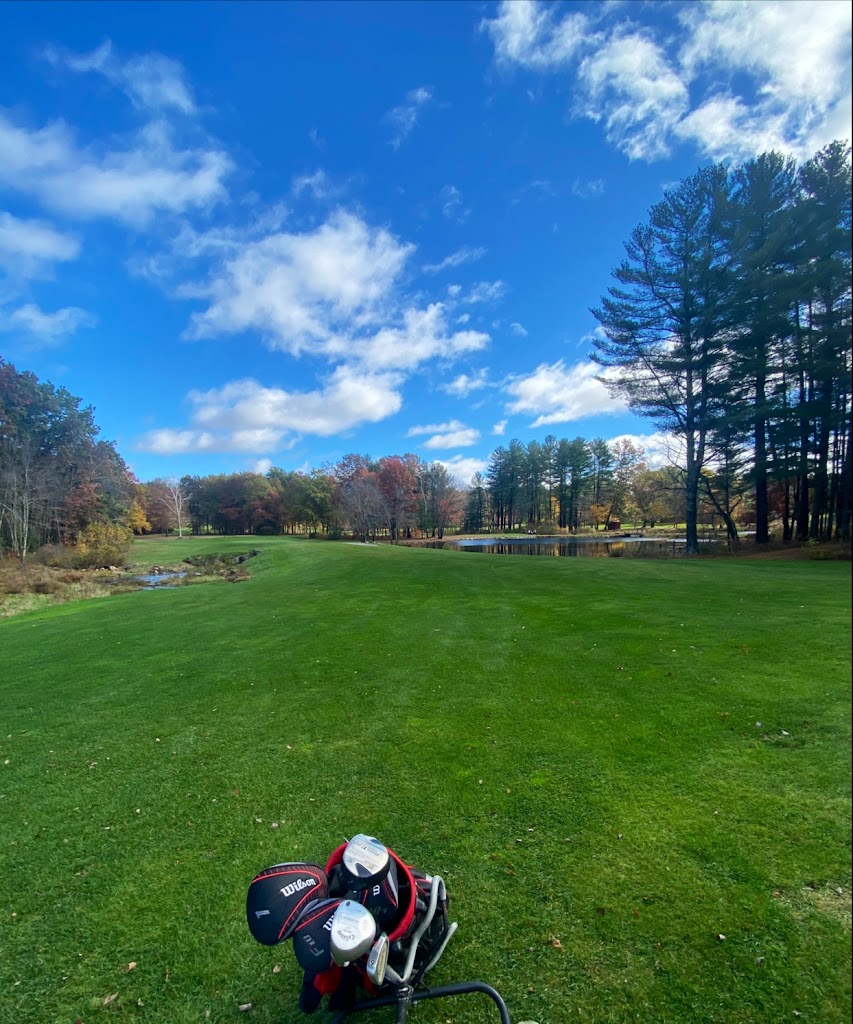 Panoramic view of a lush green golf course at Londonderry Country Club. Smooth