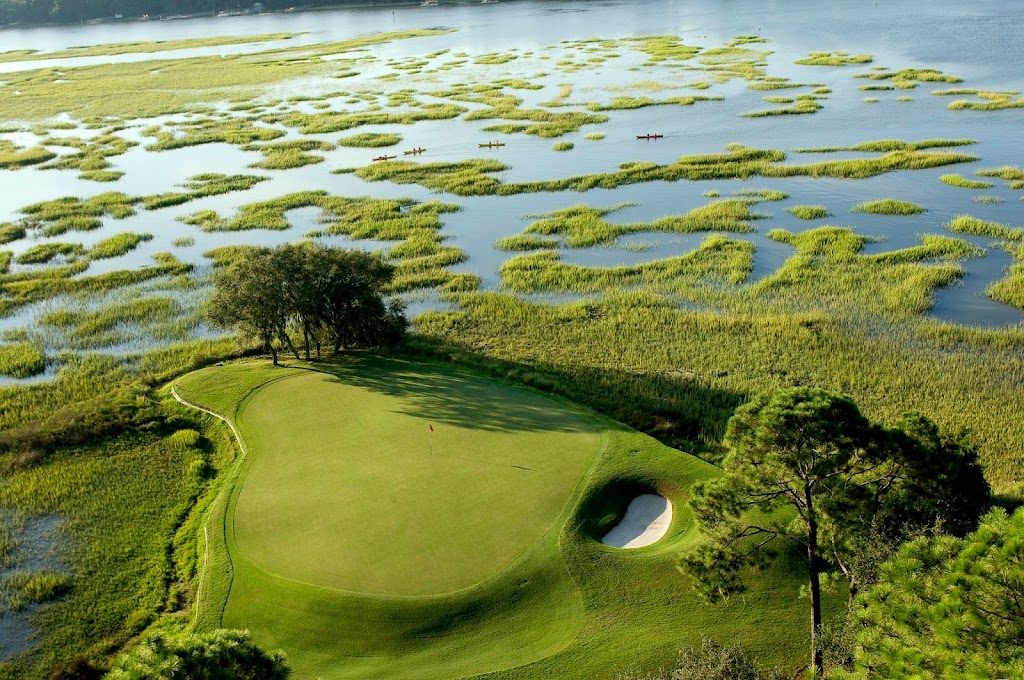 Panoramic view of a lush green golf course at Long Cove Club. Smooth