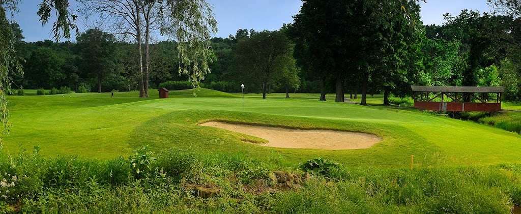 Panoramic view of a lush green golf course at Lyman Orchards Golf Club. Smooth