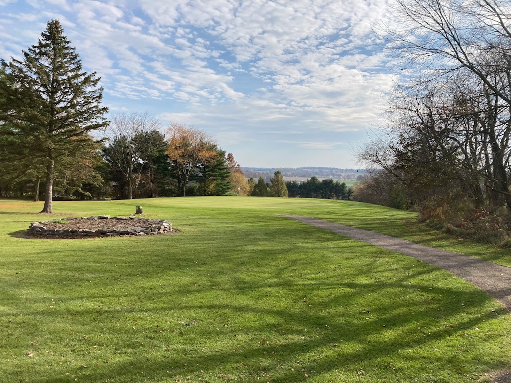 Panoramic view of a lush green golf course at Lyons Den Golf Course. Smooth