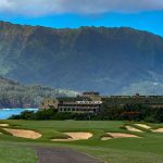 Panoramic view of a lush green golf course at Makai Golf Course. Smooth