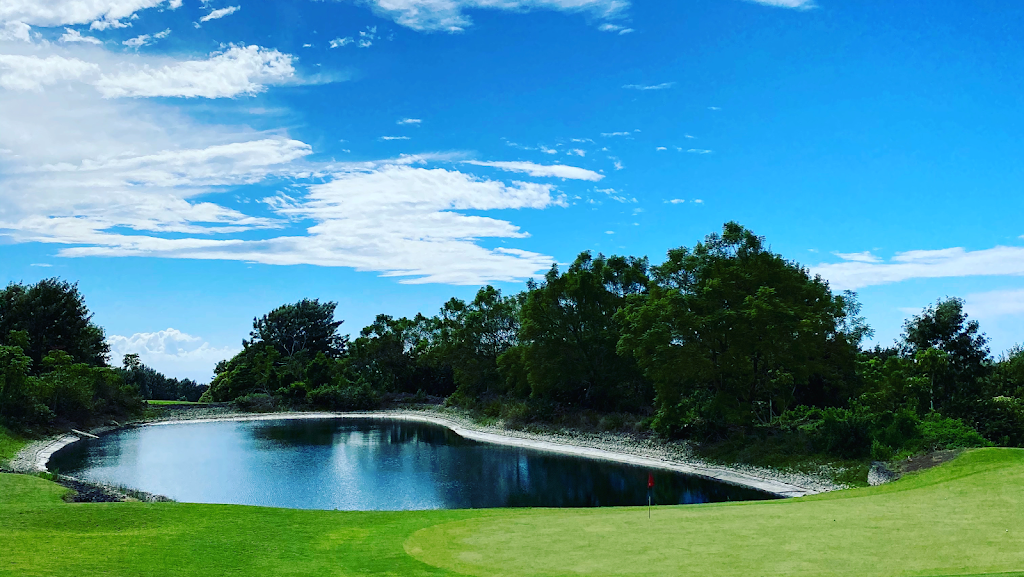 Panoramic view of a lush green golf course at Makalei Golf Club. Smooth