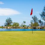 Panoramic view of a lush green golf course at Makani Golf Club. Smooth