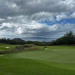 Panoramic view of a lush green golf course at Makena Golf & Beach Club. Smooth