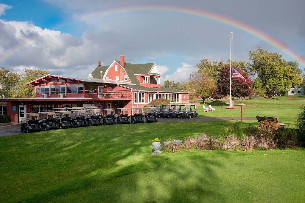 Panoramic view of a lush green golf course at Manistee Golf & Country Club. Smooth