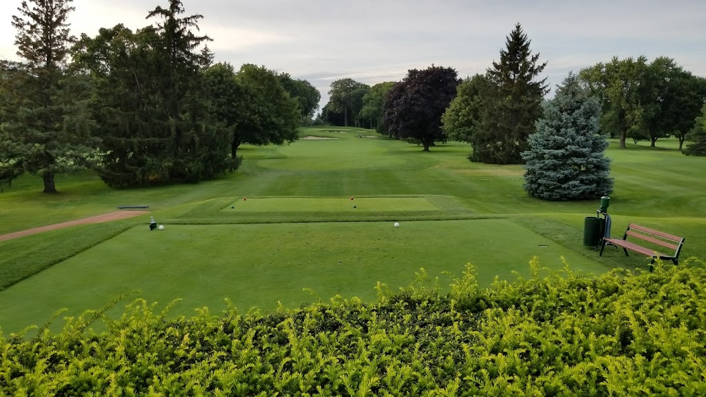 Panoramic view of a lush green golf course at Maple Bluff Country Club. Smooth