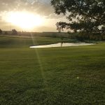 Panoramic view of a lush green golf course at Mariah Hills Golf Course Maintenance. Smooth