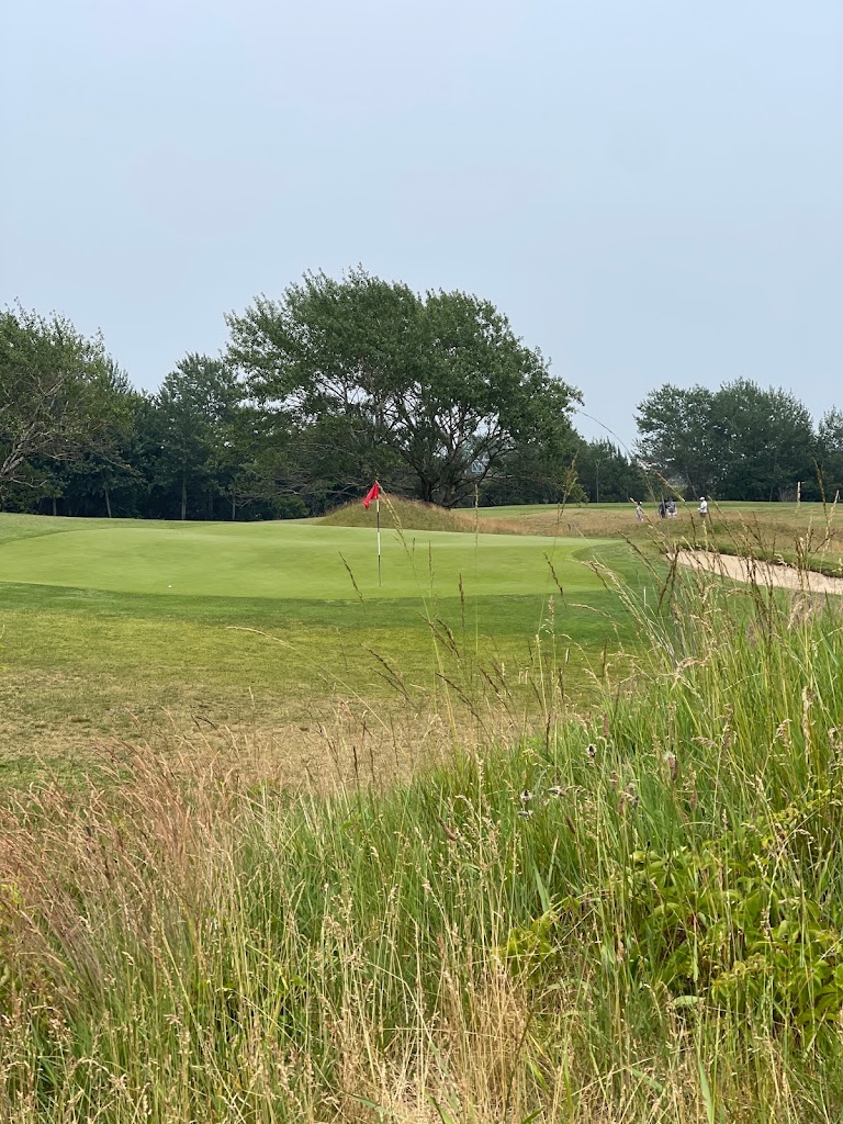 Panoramic view of a lush green golf course at Marine Park Golf Course. Smooth