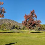 Panoramic view of a lush green golf course at Marshall Canyon. Smooth