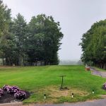 Panoramic view of a lush green golf course at Martindale Country Club. Smooth