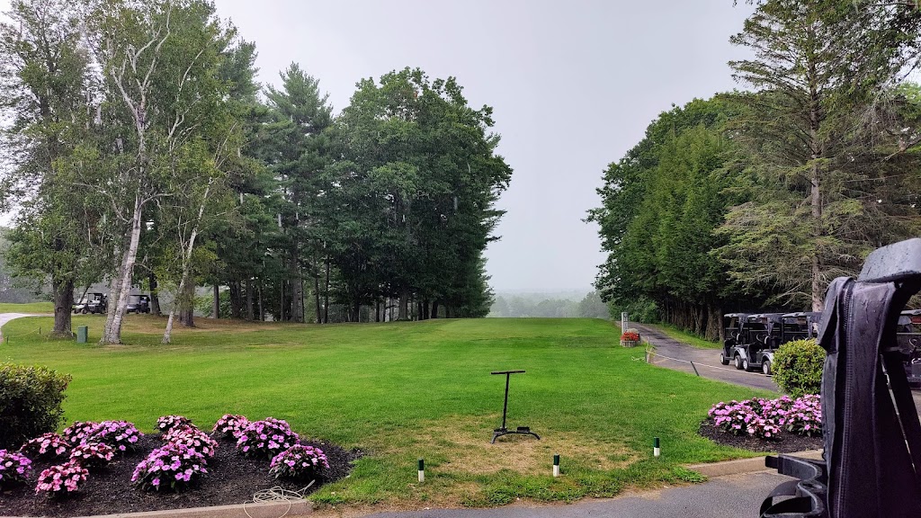 Panoramic view of a lush green golf course at Martindale Country Club. Smooth