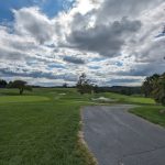 green grass with the flag in the hole.