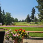 Panoramic view of a lush green golf course at McNary Golf Club. Smooth