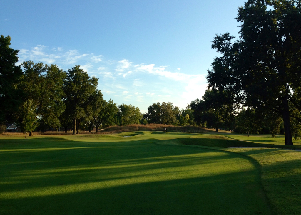 Panoramic view of a lush green golf course at Meadowbrook Country Club. Smooth