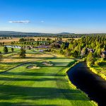 Panoramic view of a lush green golf course at Meadows Golf Course. Smooth