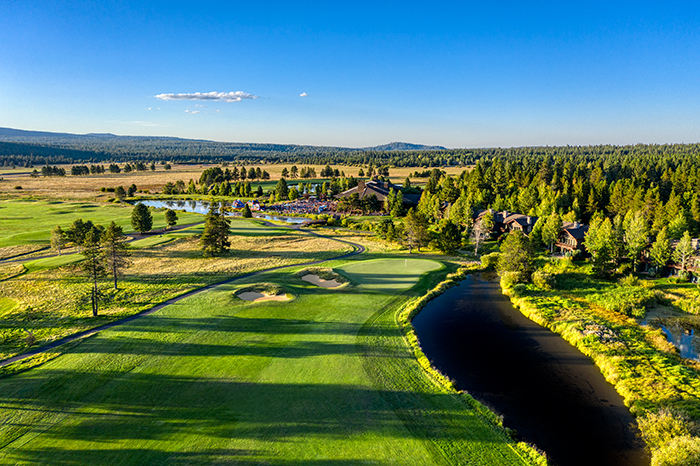 Panoramic view of a lush green golf course at Meadows Golf Course. Smooth