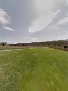 Panoramic view of a lush green golf course at Miami Whitewater Forest Golf Course. Smooth