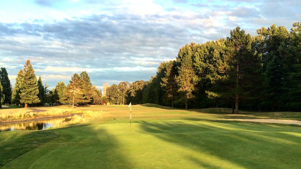 Panoramic view of a lush green golf course at Michelbook Country Club. Smooth