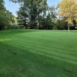 Panoramic view of a lush green golf course at Michigan City Municipal Golf Course - North. Smooth