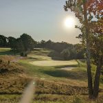 Panoramic view of a lush green golf course at Midville Golf Club. Smooth