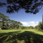 Panoramic view of a lush green golf course at Mililani Golf Club. Smooth