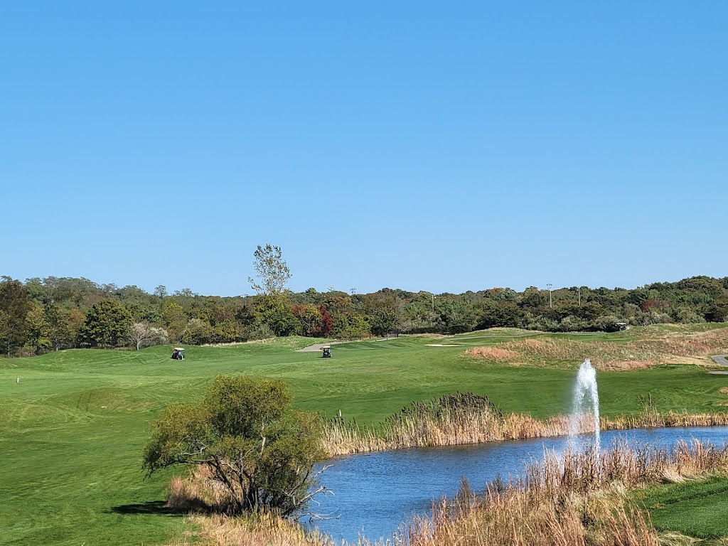 Panoramic view of a lush green golf course at Mill Pond Golf Course. Smooth