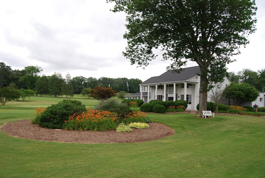 Panoramic view of a lush green golf course at Mimosa Hills Golf Club. Smooth