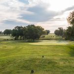 Panoramic view of a lush green golf course at Minneapolis Golf Course. Smooth