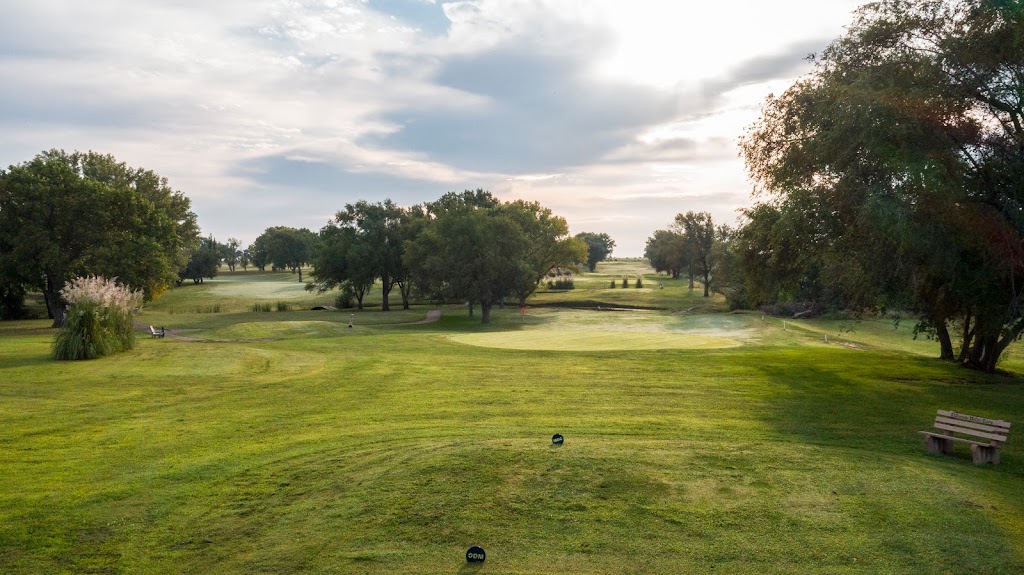 Panoramic view of a lush green golf course at Minneapolis Golf Course. Smooth