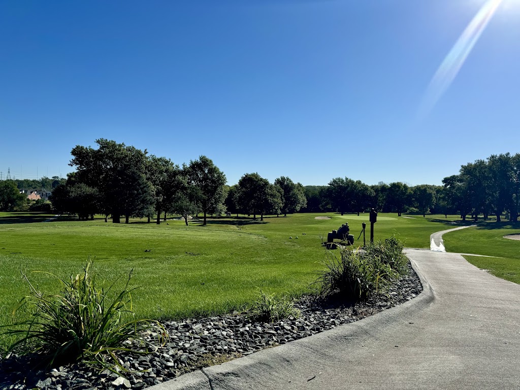 Panoramic view of a lush green golf course at Miracle Hill. Smooth