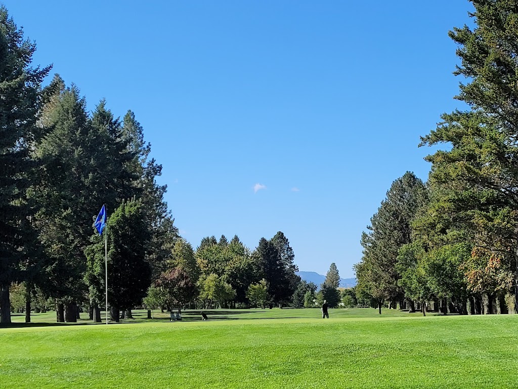 Panoramic view of a lush green golf course at Missoula Country Club. Smooth