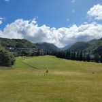 Panoramic view of a lush green golf course at Moanalua Golf Club. Smooth