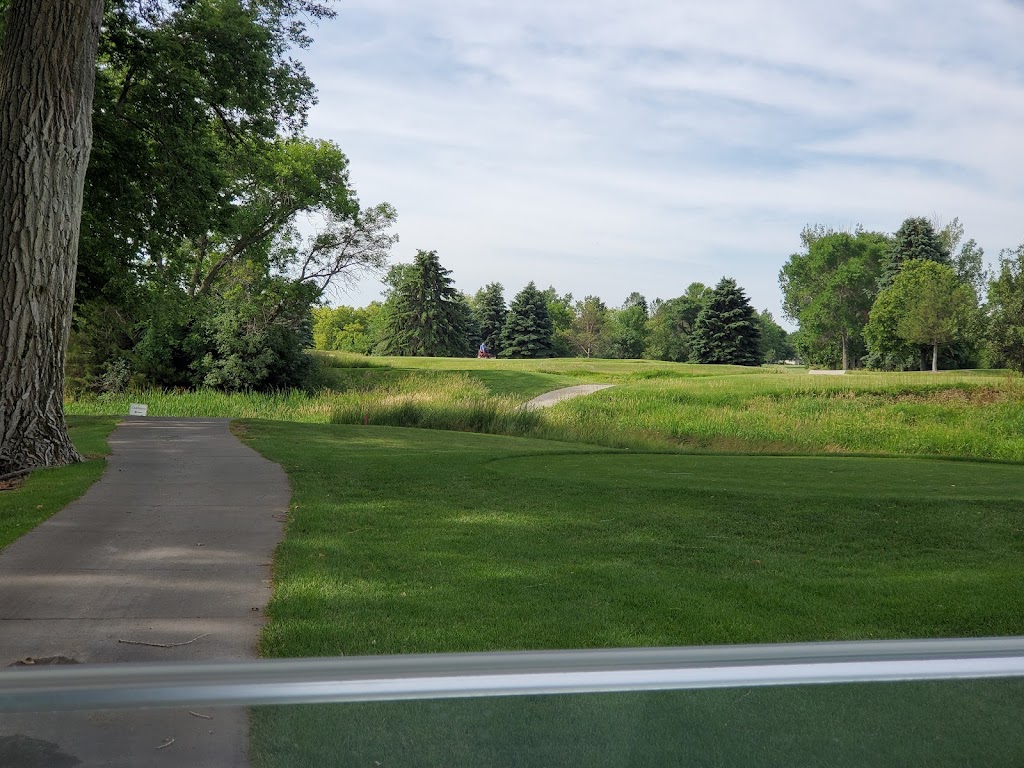 Panoramic view of a lush green golf course at Moccasin Creek Country Club. Smooth