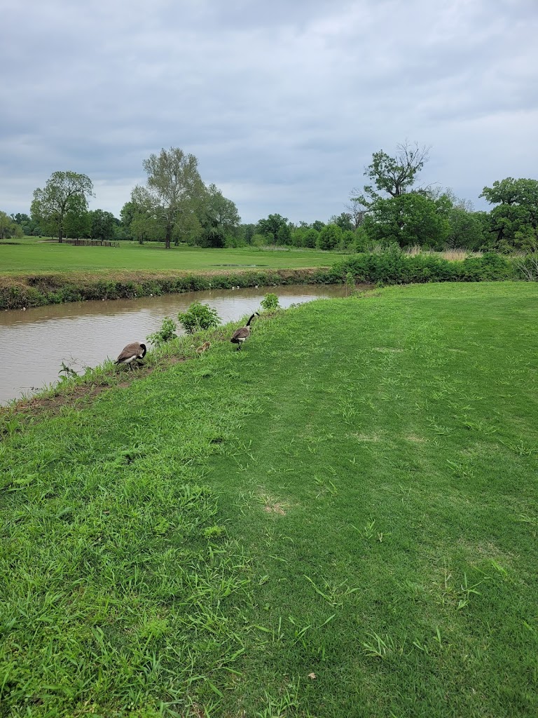 Panoramic view of a lush green golf course at Mohawk Park Golf Course. Smooth