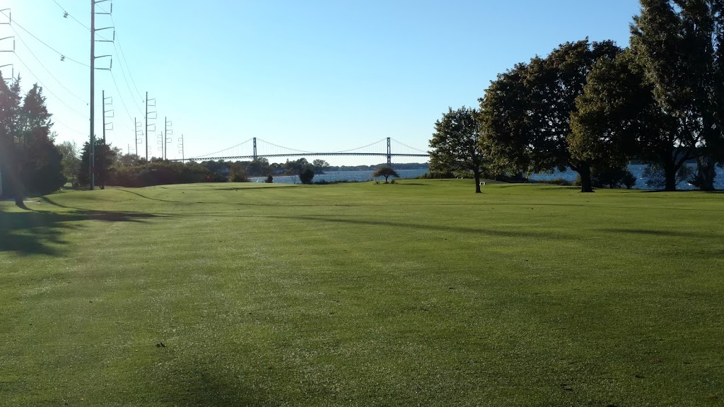 Panoramic view of a lush green golf course at Montaup Country Club. Smooth