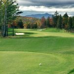 Panoramic view of a lush green golf course at Montcalm Golf Club. Smooth