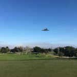 Panoramic view of a lush green golf course at Monterey Pines Golf Club. Smooth