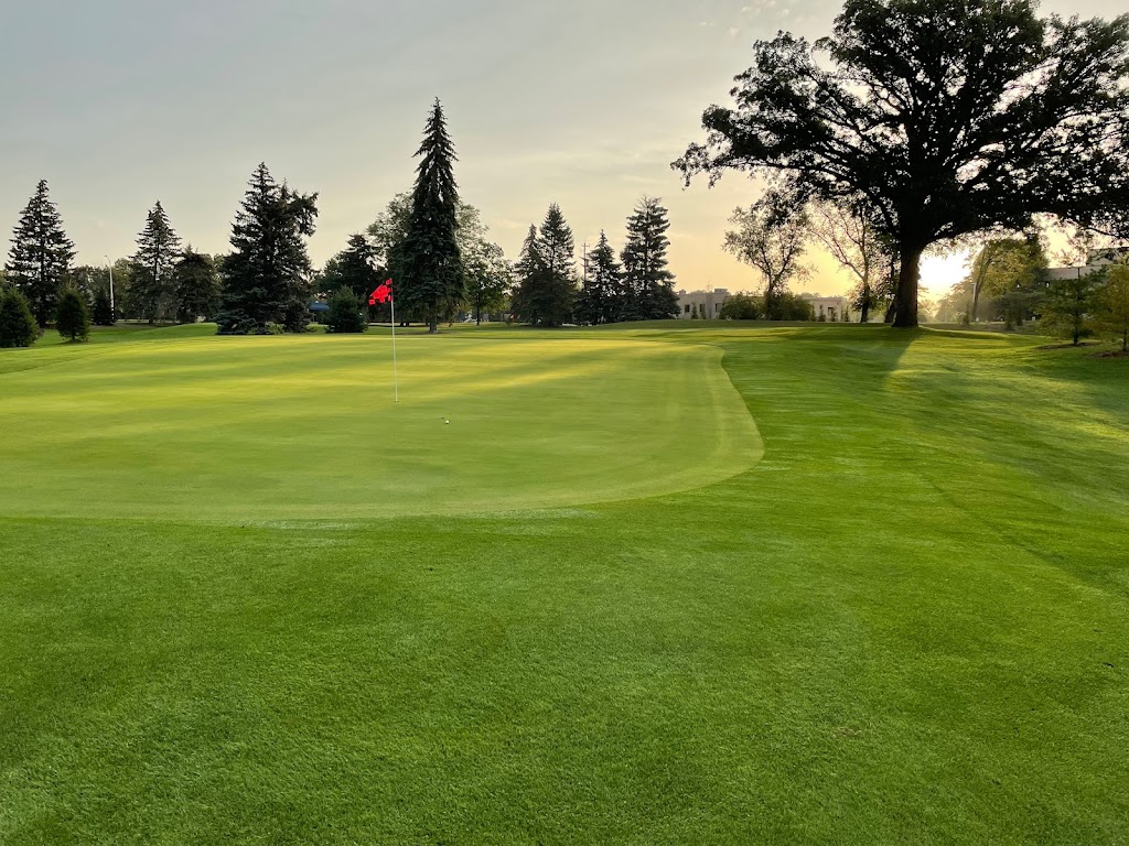 Panoramic view of a lush green golf course at Moor Downs Golf Course. Smooth