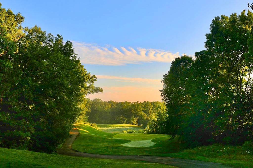 Panoramic view of a lush green golf course at Moose Ridge Golf Course. Smooth